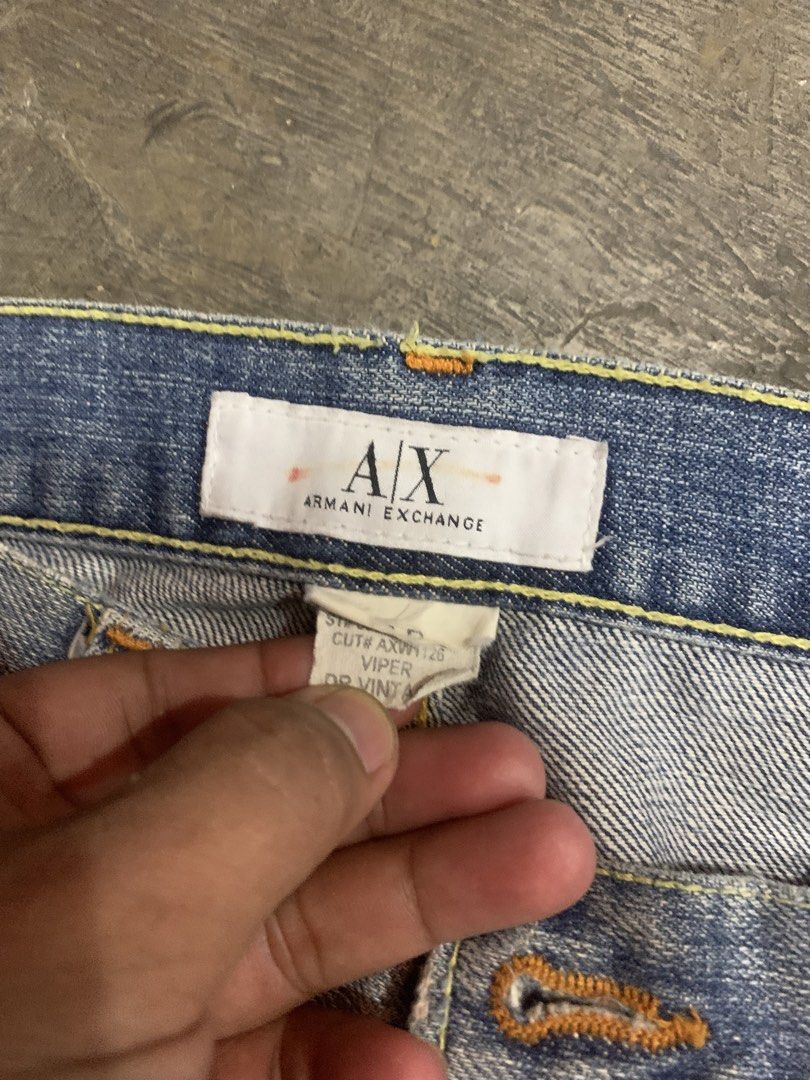 Armani Exchange Viper Vintage Denim Jeans (Category: Jeans) located in Cagayan de Oro. Submitted by agboysalis60090 (Listing ID 1469710794, Image 3). Description: Armani Exchange Viper Vintage light wash denim jeans. Straight leg fit with factory distressing on knees and thighs. Branded metal button fly. Brown leather back waistband patch with embossed logo. Classic five pocket design with contrast stitching. Tagged cut number AXW1126..