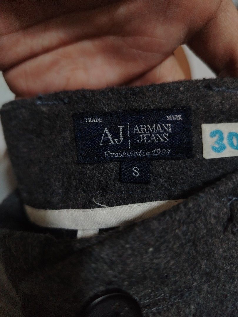 Armani Jeans Grey Wool Blend Trousers Size S (Category: Trousers) located in Quezon City. Submitted by kimzxc_536 (Listing ID 1469692589, Image 3). Description: - Brand: Armani Jeans - Size: S (Fits waist 30) - Material: 80% Wool, 20% Polyester (warm & cozy for colder days) - Color: Grey - Details: Classic tailored cut, two back pockets, signature small red AJ embroidery near the front pocket - Origin: Made in China - Condition: Clean overall.
