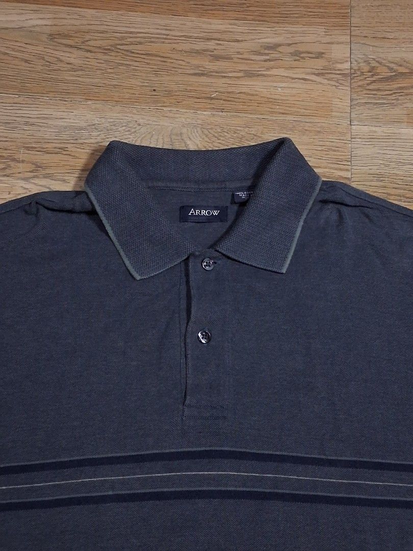 Arrow Polo Shirt (Dark gray) (Category: Tshirts & Polo Shirts ) located in General Mariano Alvarez. Submitted by klasiko.19 (Listing ID 1469690716, Image 3). Description: Arrow Polo Shirt (Dark gray) • Condition: Excellent 9/10 - Minimal signs of wear, very good overall condition. • Material: 100% Cotton • Size: M (Tag), Can fit up to Large • Pit-to-pit: 22" • Length: 29".