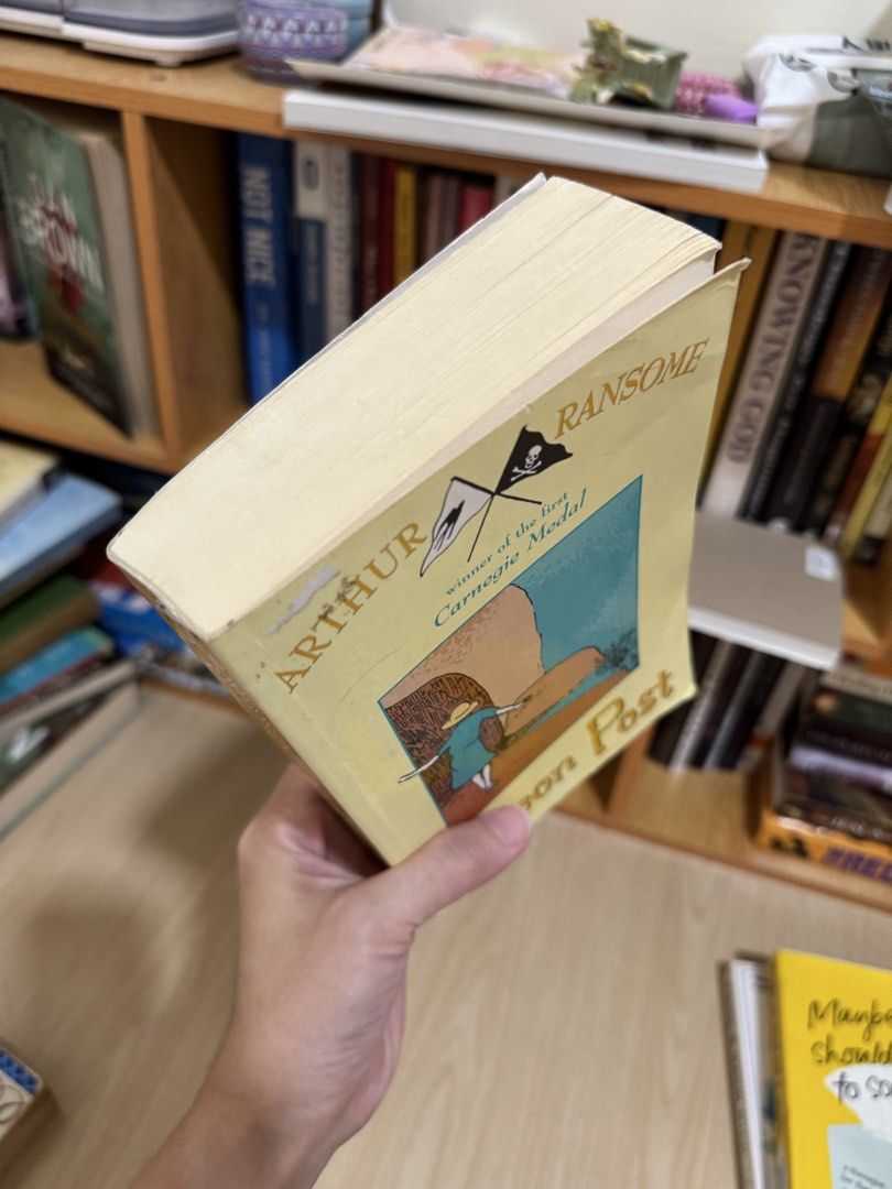Arthur Ransome Pigeon Post Paperback (Category: Storybooks) located in Quezon City. Submitted by mm_dxm (Listing ID 1469590344, Image 3). Description: - Title: Pigeon Post by Arthur Ransome - Accolade: Winner of the first-ever Carnegie Medal - Format: Paperback with a classic yellow cover - Condition: Minor wear on the top left corner of the cover; pages have natural yellowing due to age - Genre: Timeless adventure story, perfect for collectors a