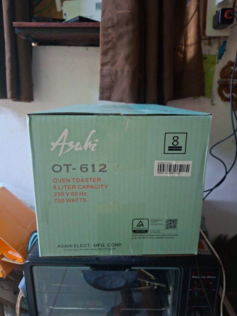 Asahi OT-612 Oven Toaster (Category: Ovens & Toasters) located in Quezon City. Submitted by naysven (Listing ID 1469579260, Image 3). Description: - Brand: Asahi OT-612 Oven Toaster - Capacity: 6 Liters with 700W power (230V~60Hz) - Build: Powder-coated steel body, stainless steel handle, and ceramic heating tube - Features: Large viewing glass door, pilot lamp, and 15-minute timer - Safety: Double insulation AC cord - Inclusions: Baking tray, wi