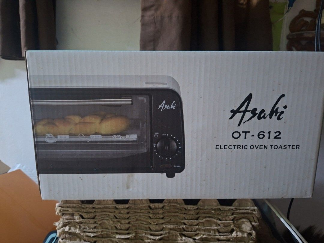 Asahi OT-612 Oven Toaster (Category: Ovens & Toasters) located in Quezon City. Submitted by naysven (Listing ID 1469579260, Image 2). Description: - Brand: Asahi OT-612 Oven Toaster - Capacity: 6 Liters with 700W power (230V~60Hz) - Build: Powder-coated steel body, stainless steel handle, and ceramic heating tube - Features: Large viewing glass door, pilot lamp, and 15-minute timer - Safety: Double insulation AC cord - Inclusions: Baking tray, wi