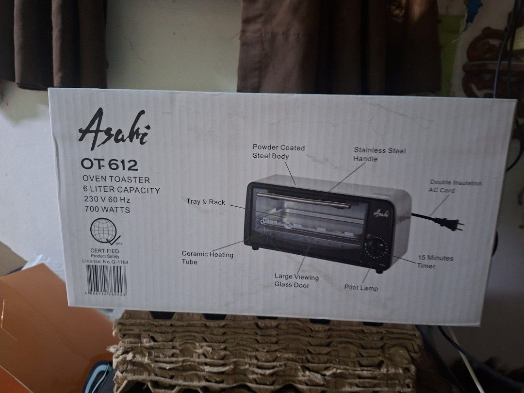 Asahi OT-612 Oven Toaster (Category: Ovens & Toasters) located in Quezon City. Submitted by naysven (Listing ID 1469579260, Image 1). Description: - Brand: Asahi OT-612 Oven Toaster - Capacity: 6 Liters with 700W power (230V~60Hz) - Build: Powder-coated steel body, stainless steel handle, and ceramic heating tube - Features: Large viewing glass door, pilot lamp, and 15-minute timer - Safety: Double insulation AC cord - Inclusions: Baking tray, wi