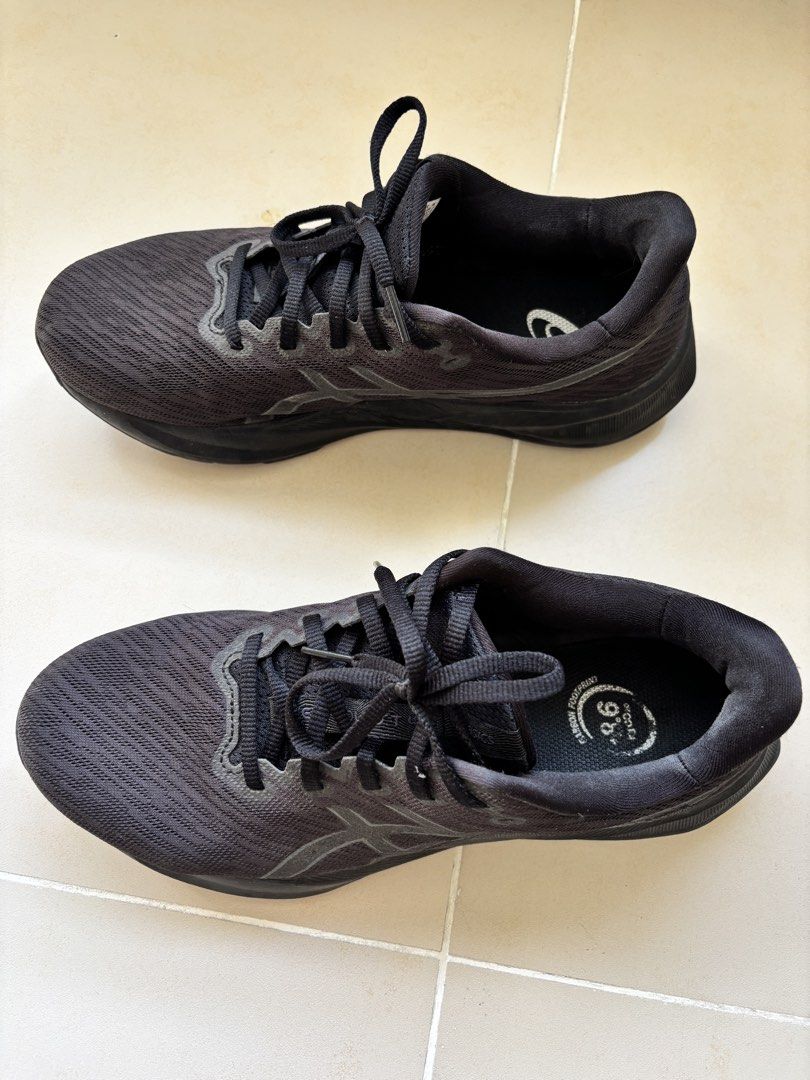 ASICS Black Running Shoes US 9.5 (Category: Casual Shoes) located in Manila. Submitted by _minimalist__ (Listing ID 1469578063, Image 1). Description: - Brand/Model: ASICS Running Shoes - Color: All Black (mesh upper, matching laces, solid rubber outsoles) - Size: US 9.5 / EUR 43.5 (Wide Fit) - Condition: Normal signs of wear on the bottom tread - Special Feature: Carbon footprint branding on inner soles.