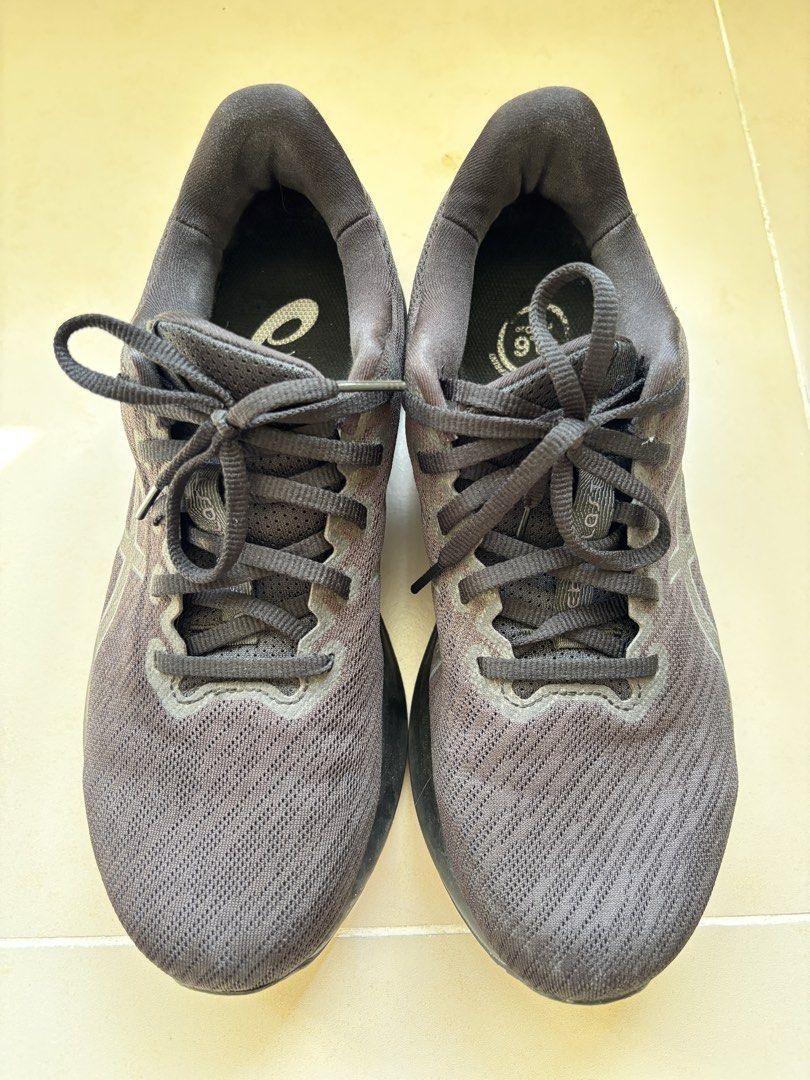 ASICS Black Running Shoes US 9.5 (Category: Casual Shoes) located in Manila. Submitted by _minimalist__ (Listing ID 1469578063, Image 2). Description: - Brand/Model: ASICS Running Shoes - Color: All Black (mesh upper, matching laces, solid rubber outsoles) - Size: US 9.5 / EUR 43.5 (Wide Fit) - Condition: Normal signs of wear on the bottom tread - Special Feature: Carbon footprint branding on inner soles.