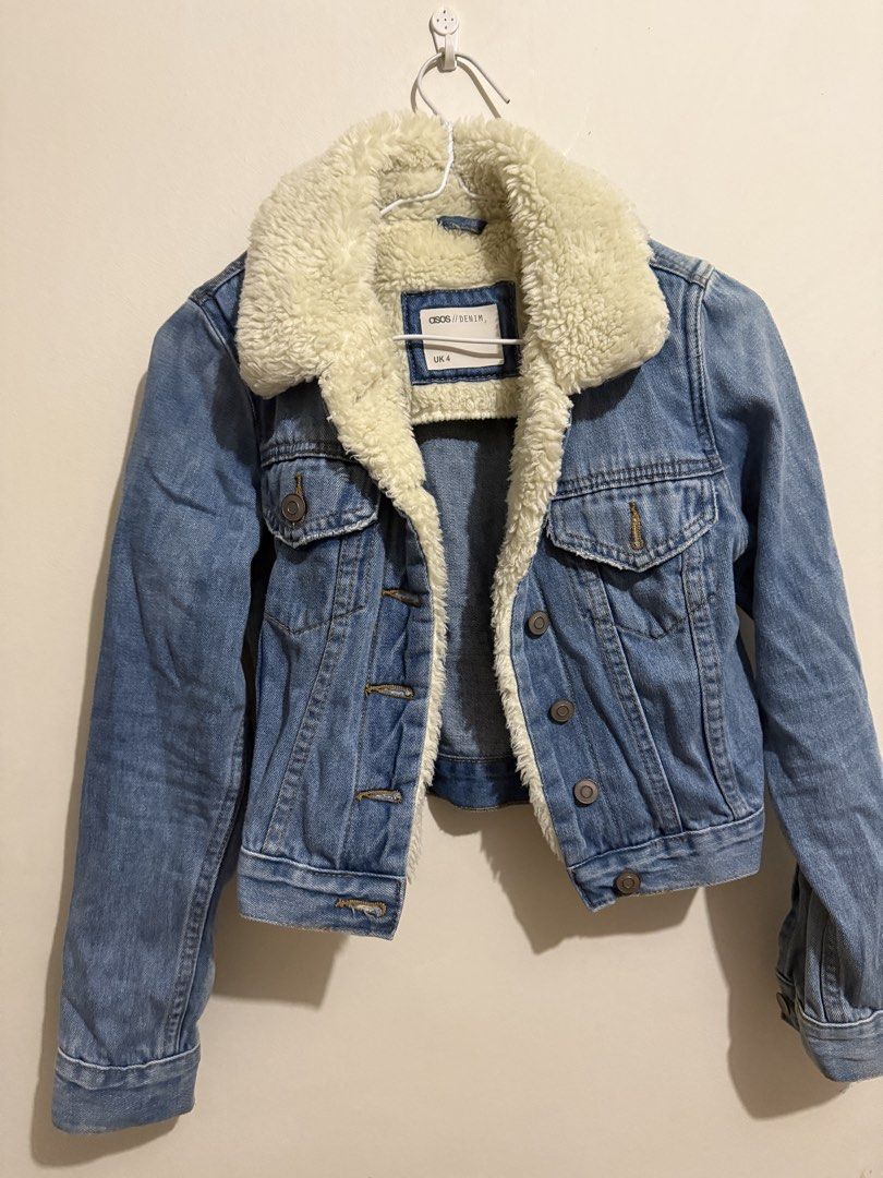 ASOS Denim Sherpa Jacket UK 4 (Category: Coats, Jackets and Outerwear) located in San Fernando. Submitted by richeloy (Listing ID 1469582268, Image 1). Description: - Brand/Style: ASOS denim jacket with classic blue wash - Lining: Warm cream sherpa collar and lining - Closure: Button-up front with durable metal buttons - Pockets: Dual chest pockets and two lower pockets - Size: UK 4 - Condition/Details: Sturdy and cozy outerwear piece, perfect fo