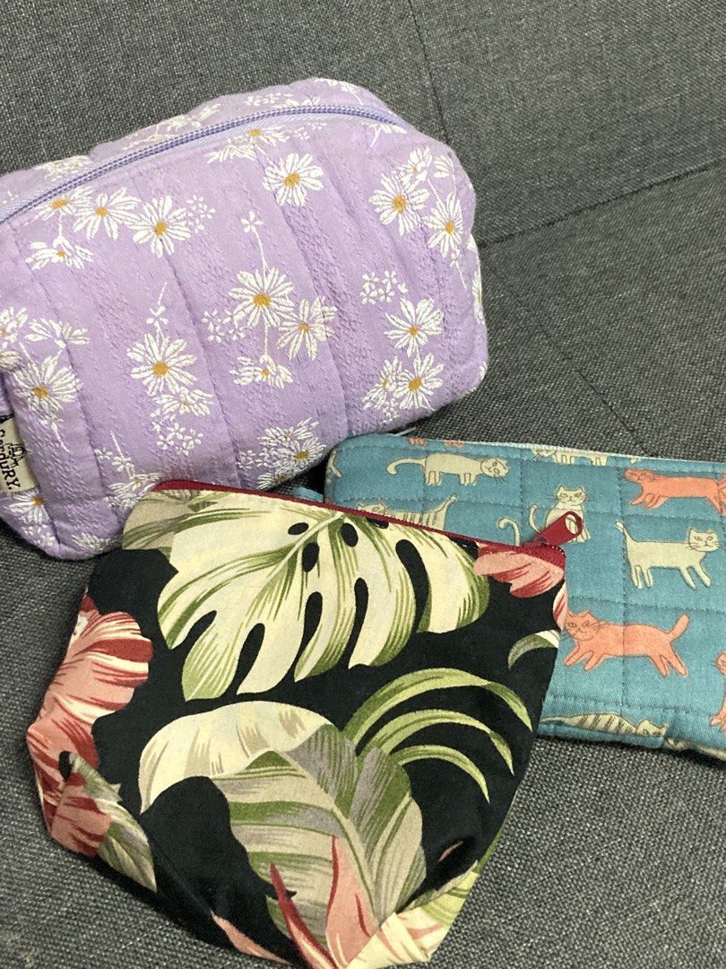 Assorted Pouches and Coin Purse (Category: Purses & Pouches) located in Quezon City. Submitted by clutterthings_ (Listing ID 1469689318, Image 1). Description: Take all for 200 Make up pouch with make up stains but can be washed.