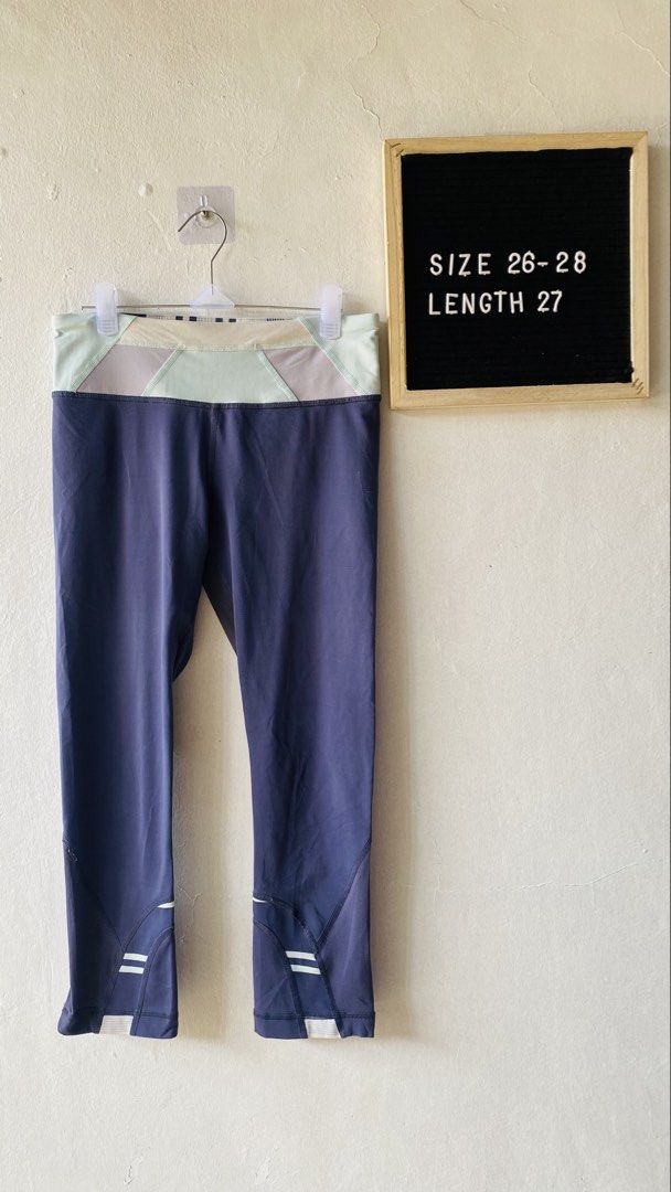 Athletic Leggings (Category: Activewear) located in Caloocan City. Submitted by lovemyclothes21 (Listing ID 1469610728, Image 1). Description: - Color: Navy blue with pastel green and purple contrast waistband - Length: Cropped (approx. 27 inches) - Storage: Secure zip pocket at the back for small essentials - Breathability: Mesh panels behind the knees - Safety: Reflective stripes near cuffs for low-light running - Fabric: Stretchy and comfortab