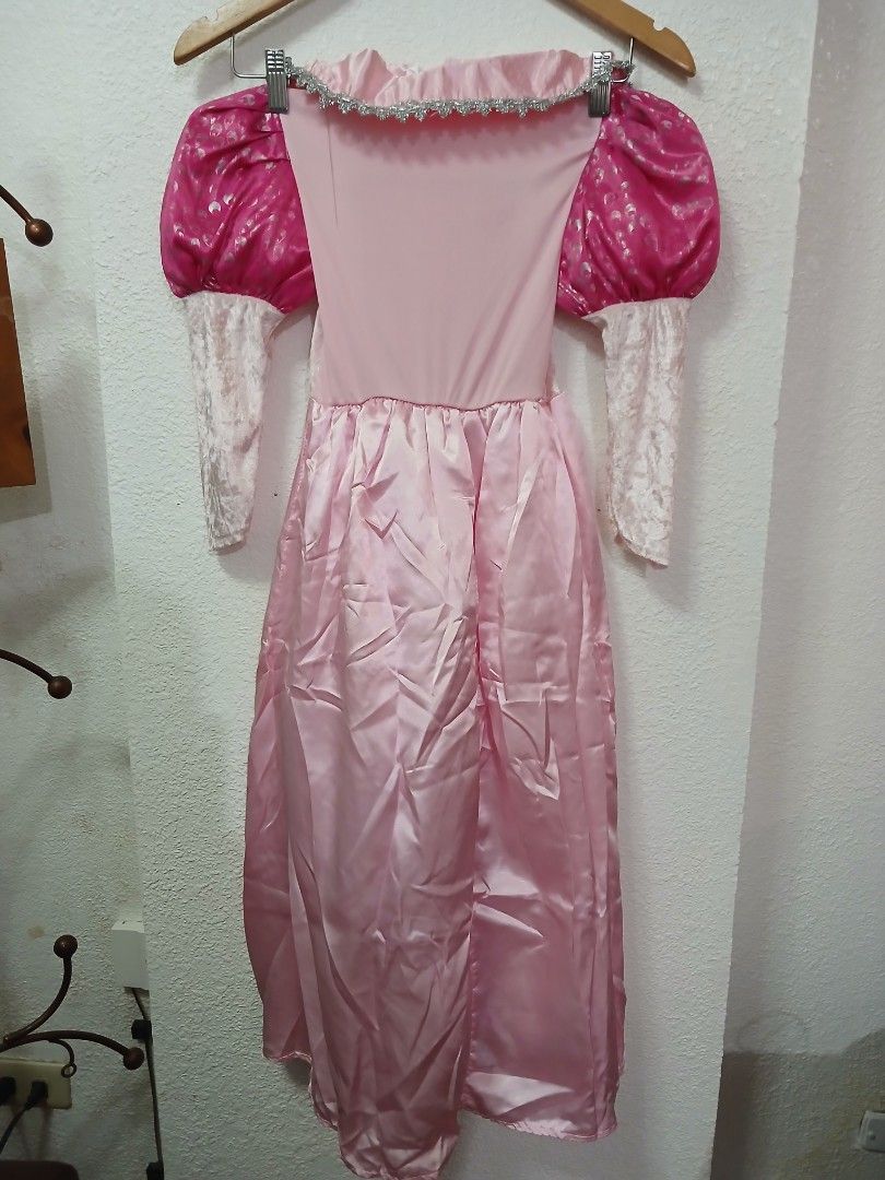 Aurora costume (Category: Babies & Kids Fashion) located in Manila. Submitted by salcedones31366 (Listing ID 1469646420, Image 3). Description: - Stunning pink princess costume dress - Long white velvet sleeves with puffy pink shoulders - Hot pink panels with metallic silver prints -best fit 8 to 10 - Elegant silver lace trim on the square neckline and bodice - Smooth pale and bright pink satin skirt - Ideal for parties, Halloween, or fun dress-u