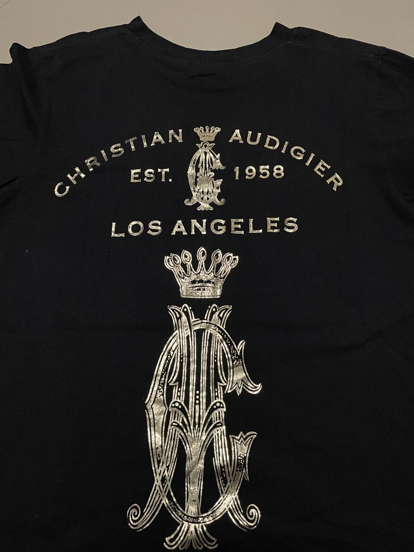 Authentic Christian Audigier Black Tattoo Hands Graphic Tee (Category: Tshirts & Polo Shirts ) located in Mabalacat. Submitted by cornistaja55233 (Listing ID 1469732914, Image 2). Description: Christian Audigier LA Gold Reflector Size M on Tag W: 19 L: 27 Cr: 9.5/10 Overall Condition: 9.5/10 Price: 299 + Shipping Fee.
