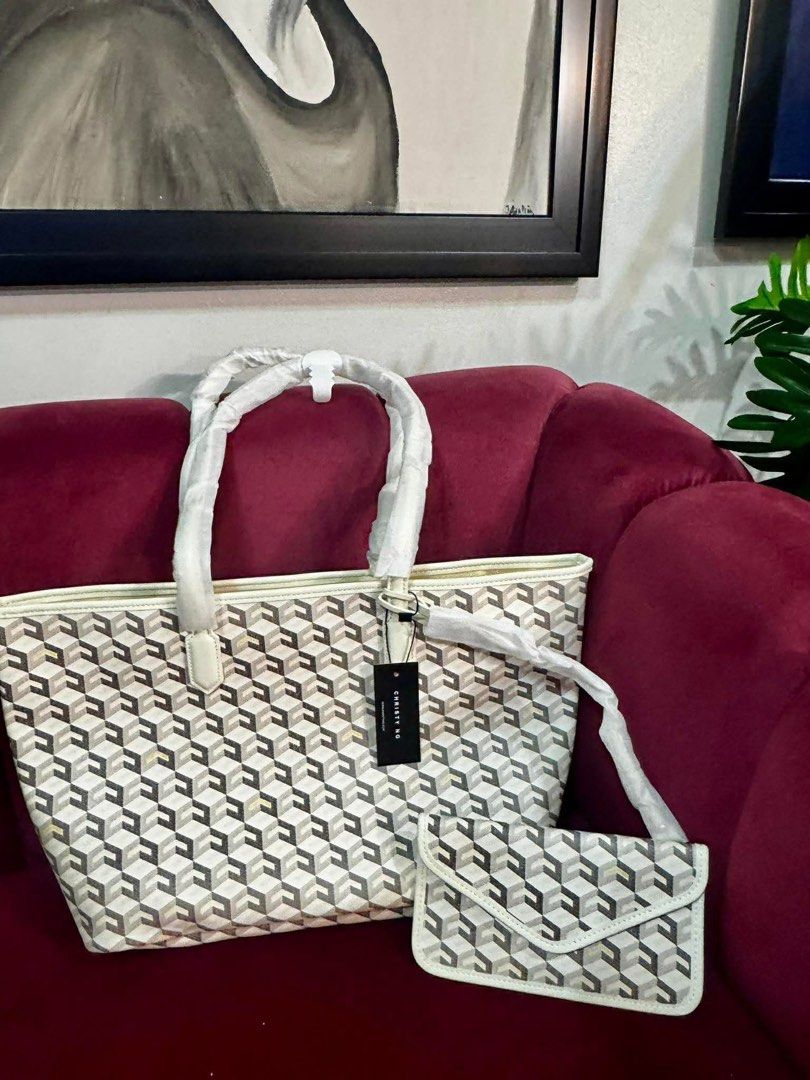 AUTHENTIC CHRISTY NG RUSSO LARGE MONOGRAM TOTE BAG 🌸 (Category: Tote Bags) located in Mandaluyong City. Submitted by simplyveaph (Listing ID 1469657248, Image 2). Description: AUTHENTIC CHRISTY NG RUSSO LARGE MONOGRAM TOTE BAG 🌸 Classic, chic, and versatile! The Christy Ng Russo Large Monogram Tote Bag in White is perfect for everyday use, shopping, travel, or work. Comes with a matching pouch for your essentials. Brand: Christy Ng Model: Russo