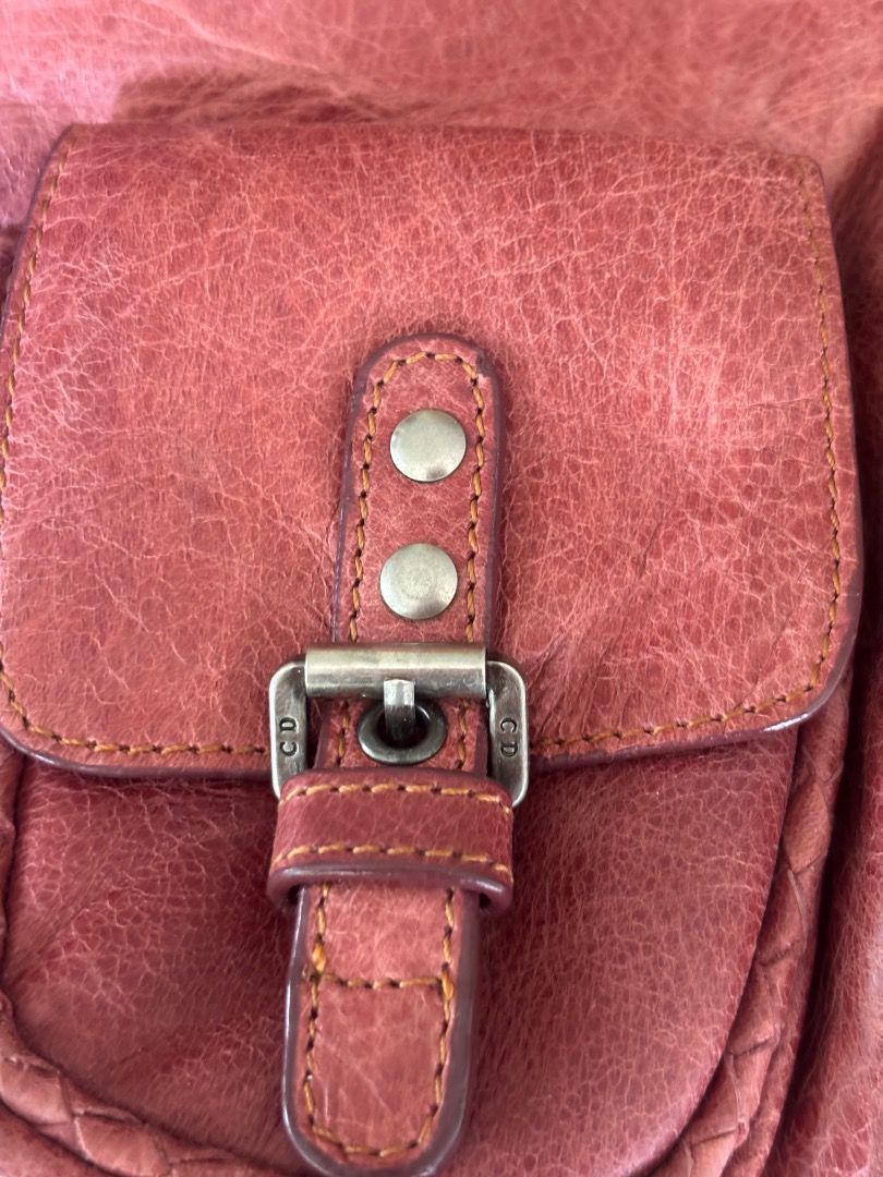 Authentic DIOR Gaucho Vintage Bag (Category: Shoulder Bags) located in Caloocan City. Submitted by dahliaeloise (Listing ID 1469604844, Image 3). Description: Brown leather Christian Dior shoulder bag. Features signature decorative charms including a key and medallion attached to the front buckle strap. Braided leather top handle with silver hardware details. Front flap closure with magnetic snap. Interior lined with Dior monogram fabric. Small f