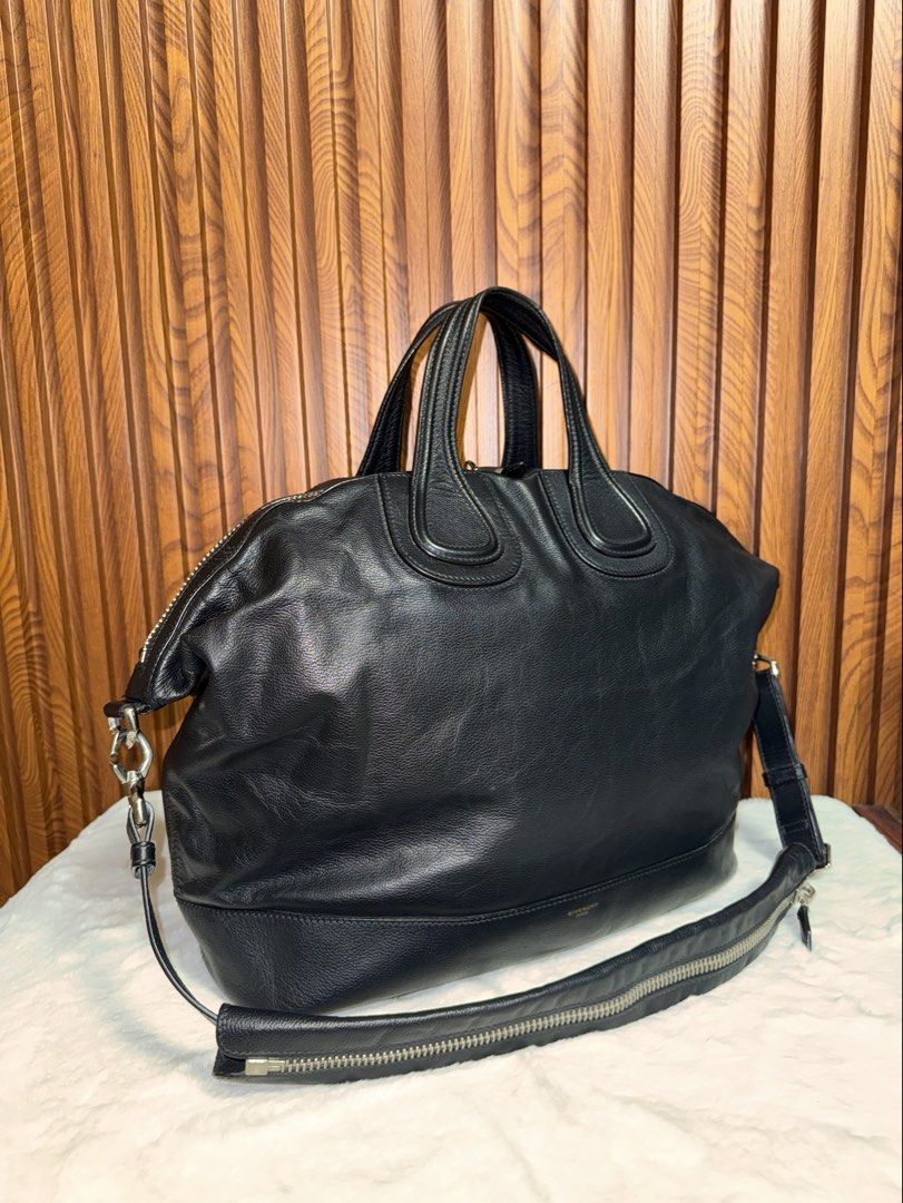 Authentic Givenchy Black Leather Nightingale Bag with Shoulder Strap (Category: Everything Else Others) located in Subic. Submitted by luxshoppe88 (Listing ID 1469702187, Image 2). Description: Authentic Givenchy Black Leather Nightingale Bag in excellent, well-maintained condition. Features premium textured leather, silver hardware, dual top handles, and a detachable shoulder strap with zip detail. Spacious interior with organizational pockets. 