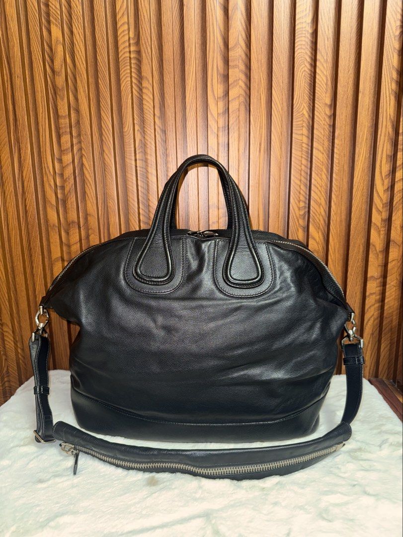 Authentic Givenchy Black Leather Nightingale Bag with Shoulder Strap (Category: Everything Else Others) located in Subic. Submitted by luxshoppe88 (Listing ID 1469702187, Image 3). Description: Authentic Givenchy Black Leather Nightingale Bag in excellent, well-maintained condition. Features premium textured leather, silver hardware, dual top handles, and a detachable shoulder strap with zip detail. Spacious interior with organizational pockets. 