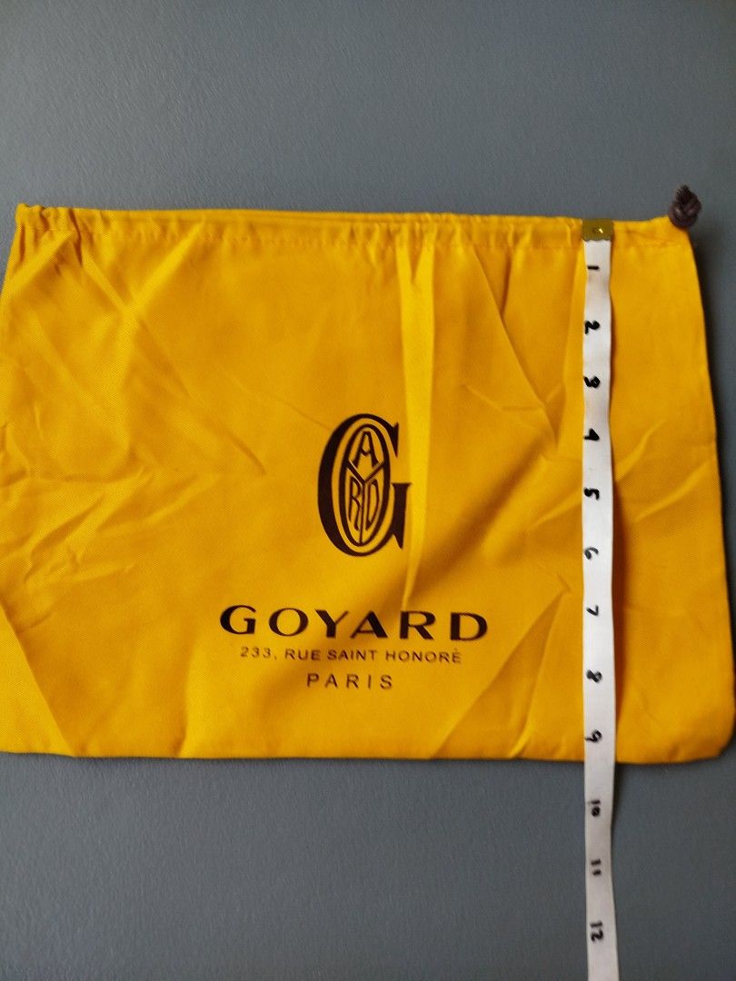 Authentic Goyard Yellow Dust Bag with Drawstring (Category: Luxury Bags & Wallets) located in Calamba. Submitted by merrymerida (Listing ID 1469633851, Image 2). Description: - Authentic bright yellow Goyard dust bag - Features iconic black logo print with Paris address details - Secure side drawstring closure - Approximate flat measurements: 13 inches across x 10 inches down - Condition: Clean fabric, no stains, damage, or flaws - Perfect for sa