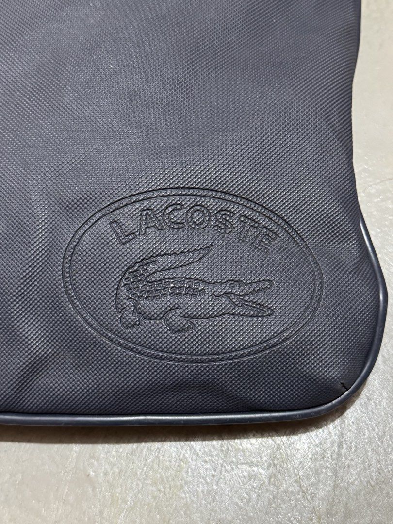 Authentic Lacoste Embossed Logo Sling/Crossbody Bag (Category: Sling Bags) located in Badian. Submitted by choloknows (Listing ID 1469732868, Image 3). Description: Excellent 9.5/10 Minor sign of use (see last 2 picture) No major issue Still presentable 11 W x 10 L 1200 + sf.