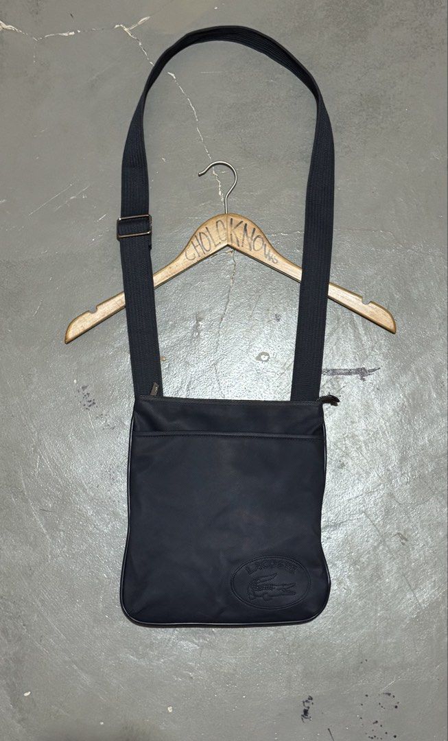 Authentic Lacoste Embossed Logo Sling/Crossbody Bag (Category: Sling Bags) located in Badian. Submitted by choloknows (Listing ID 1469732868, Image 1). Description: Excellent 9.5/10 Minor sign of use (see last 2 picture) No major issue Still presentable 11 W x 10 L 1200 + sf.