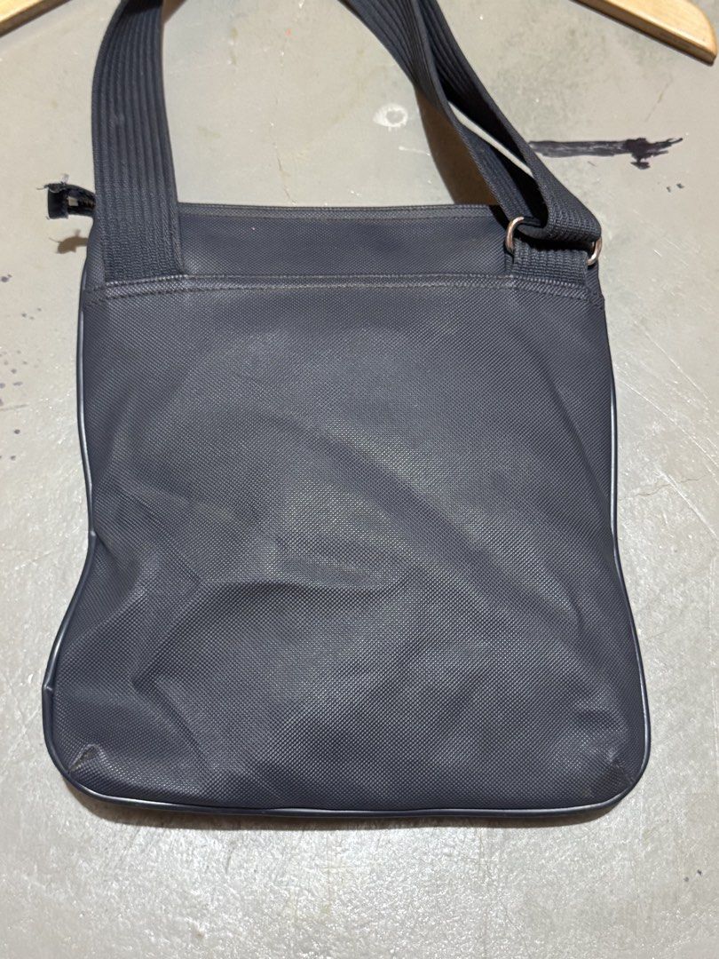 Authentic Lacoste Embossed Logo Sling/Crossbody Bag (Category: Sling Bags) located in Badian. Submitted by choloknows (Listing ID 1469732868, Image 2). Description: Excellent 9.5/10 Minor sign of use (see last 2 picture) No major issue Still presentable 11 W x 10 L 1200 + sf.