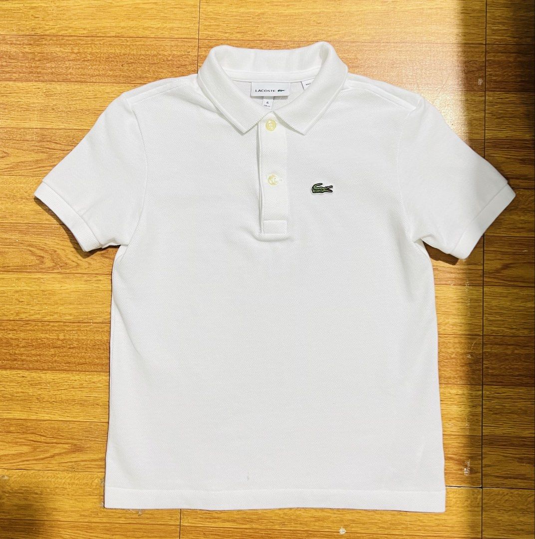 Authentic lacoste white polo shirt 6a (Category: Babies & Kids Fashion) located in Manila. Submitted by baeshop16 (Listing ID 1469694661, Image 1). Description: Good as new No issue 6a.
