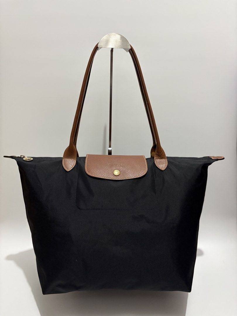 Authentic Longchamp Le Pliage Nylon Tote Bag Black (Category: Luxury Bags & Wallets) located in Subic. Submitted by dear.jeveaph (Listing ID 1469703700, Image 1). Description: Authentic Longchamp Le Pliage Large Long Handle Minimal signs of use ₱ 2,000.00 READ BEFORE BUYING ‼️ All photos are posted. Please perform your own authentication beforehand. If in DOUBT, please do NOT buy. ‼️ Friendly reminder: This is a preloved bag. Please manage your e