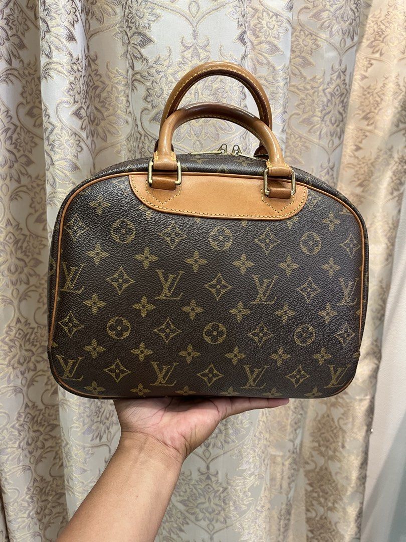 Authentic Louis Vuitton Deauville Monogram Canvas Handbag (Category: Luxury Bags & Wallets) located in General Santos City (Dadiangas). Submitted by thiftnibadi3 (Listing ID 1469665276, Image 2). Description: - Authentic Louis Vuitton Deauville handbag - Iconic brown monogram canvas with natural cowhide leather trim - Comfortable dual rolled top handles and gold-tone hardware - Convenient exterior front slip pocket - Spacious interior with fabric