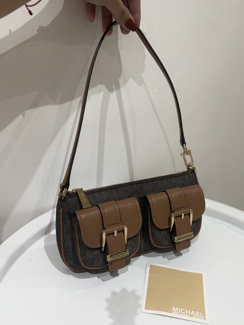 Authentic Michael Kors Pochette Mini Bag in Brown Canvas (Category: Shoulder Bags) located in Manila. Submitted by strawberrymelo (Listing ID 1469730376, Image 1). Description: - Brand New - for sure buyer only, all details posted.