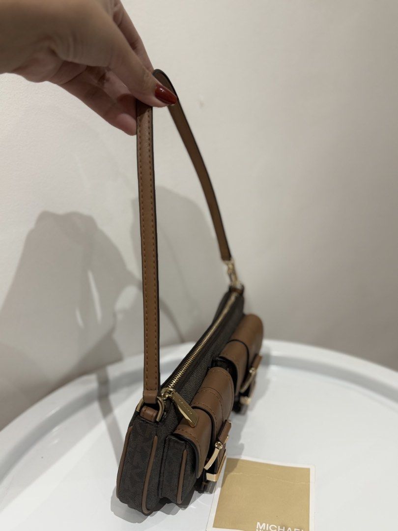 Authentic Michael Kors Pochette Mini Bag in Brown Canvas (Category: Shoulder Bags) located in Manila. Submitted by strawberrymelo (Listing ID 1469730376, Image 3). Description: - Brand New - for sure buyer only, all details posted.