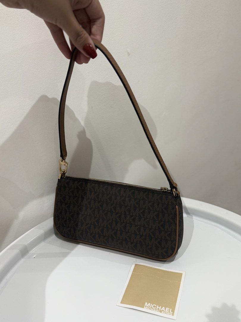 Authentic Michael Kors Pochette Mini Bag in Brown Canvas (Category: Shoulder Bags) located in Manila. Submitted by strawberrymelo (Listing ID 1469730376, Image 2). Description: - Brand New - for sure buyer only, all details posted.