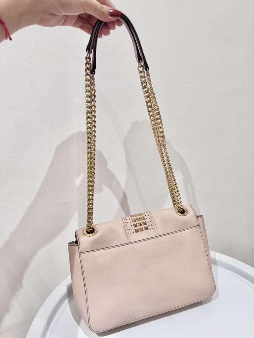 Authentic Michael Kors Two-Way Convertible Bag in Light Pink (Category: Cross-body Bags) located in Manila. Submitted by strawberrymelo (Listing ID 1469726104, Image 2). Description: For sure buyer only - Preloved, good condition - no tarnish on hardware .