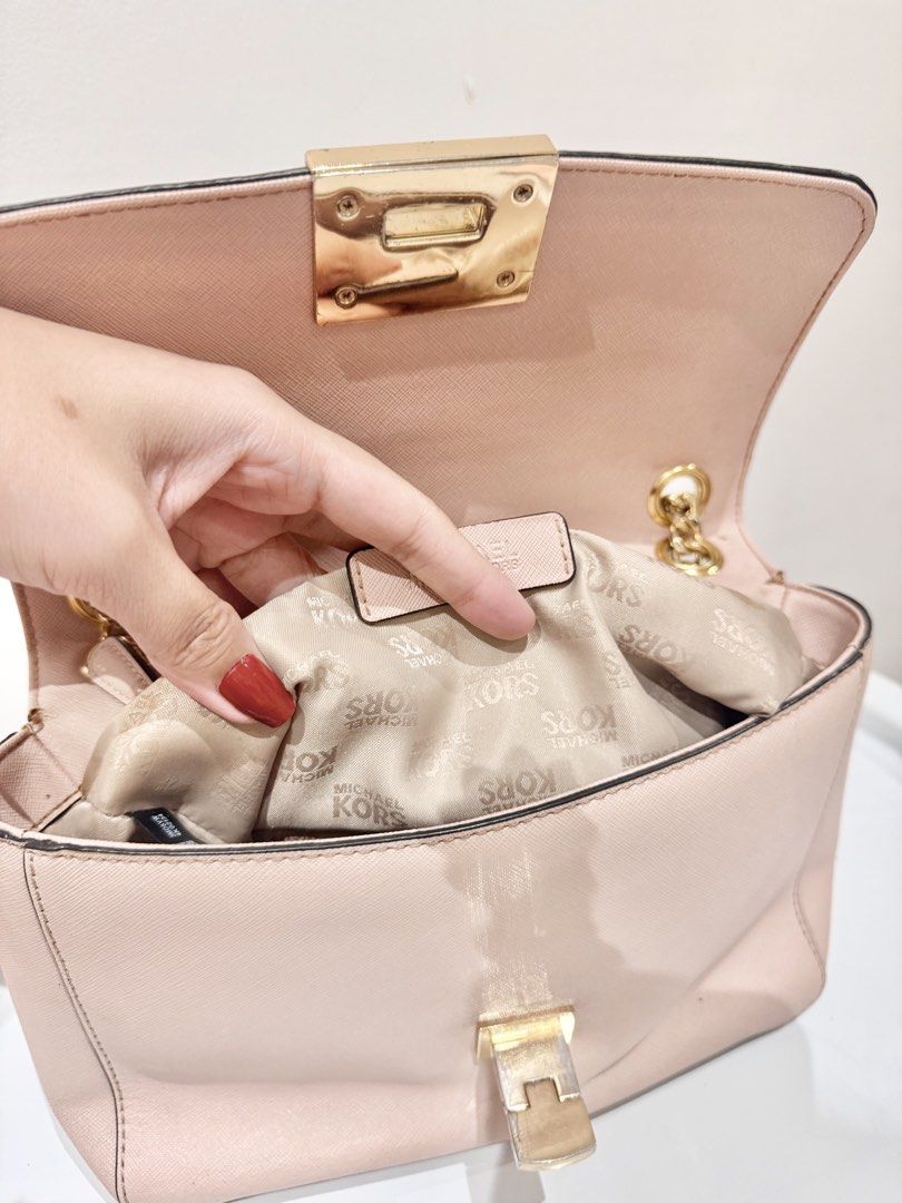 Authentic Michael Kors Two-Way Convertible Bag in Light Pink (Category: Cross-body Bags) located in Manila. Submitted by strawberrymelo (Listing ID 1469726104, Image 3). Description: For sure buyer only - Preloved, good condition - no tarnish on hardware .