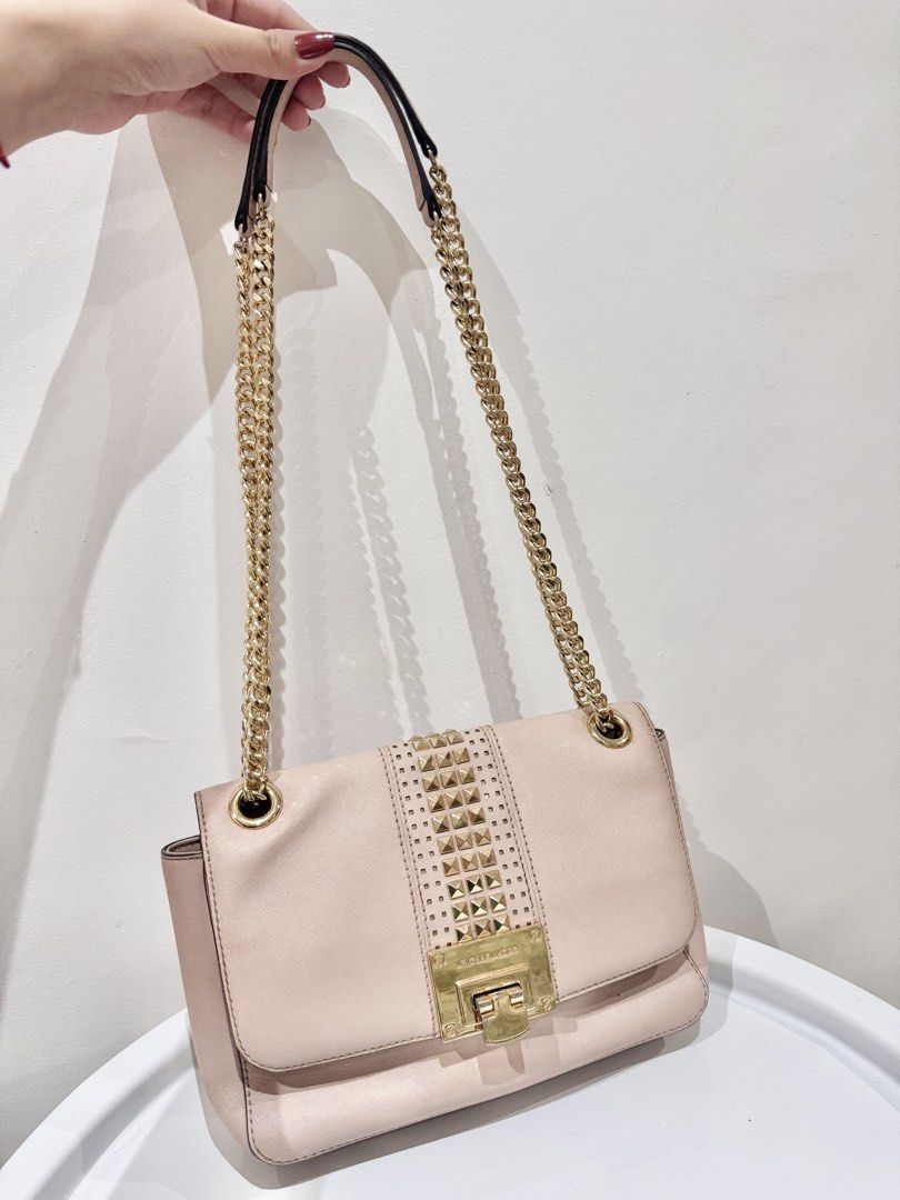 Authentic Michael Kors Two-Way Convertible Bag in Light Pink (Category: Cross-body Bags) located in Manila. Submitted by strawberrymelo (Listing ID 1469726104, Image 1). Description: For sure buyer only - Preloved, good condition - no tarnish on hardware .