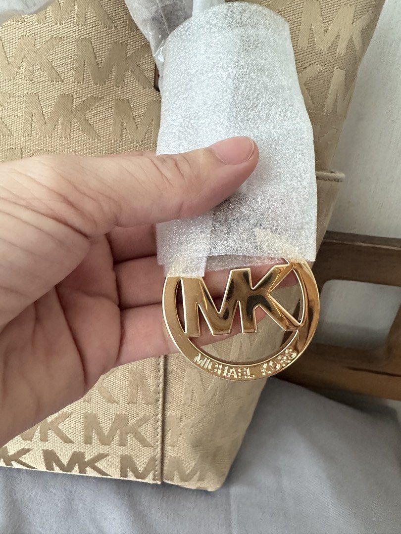 Authentic MK Charlotte Tote Bag - Beige / Tan (Category: Shoulder Bags) located in Manila. Submitted by emily.santiago (Listing ID 1469623291, Image 3). Description: Authentic Michael Kors Charlotte Large Zip Top Tote Bag (Vanilla / Beige) - BRAND NEW ✨ Condition: BRAND NEW & NEVER USED! 💯 (Protective wrappers are still intact on straps and charm as seen in photos! Price slightly negotiable.