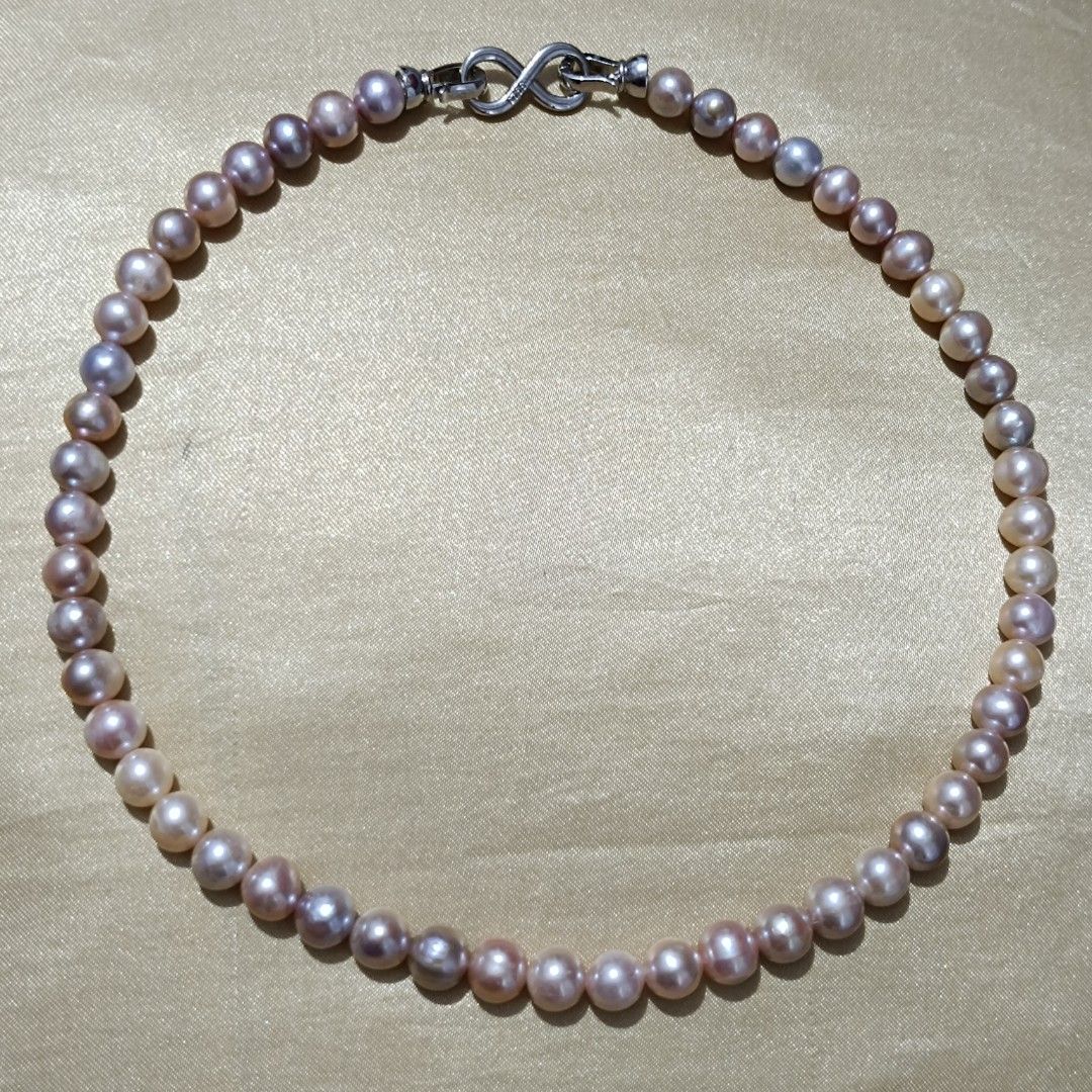 Authentic multishade freshwater pearl classic elegant necklace (Category: Necklaces) located in Imus. Submitted by luxegemjewels (Listing ID 1469635633, Image 2). Description: 🦪This elegant pearl necklace is the perfect addition to your jewelry collection. Composed of a series of carefully selected natural pearls, each pearl radiates a unique luster and hue, ranging from warm gold to soft pink, lavender, showcasing the artistry of nature. Elevat