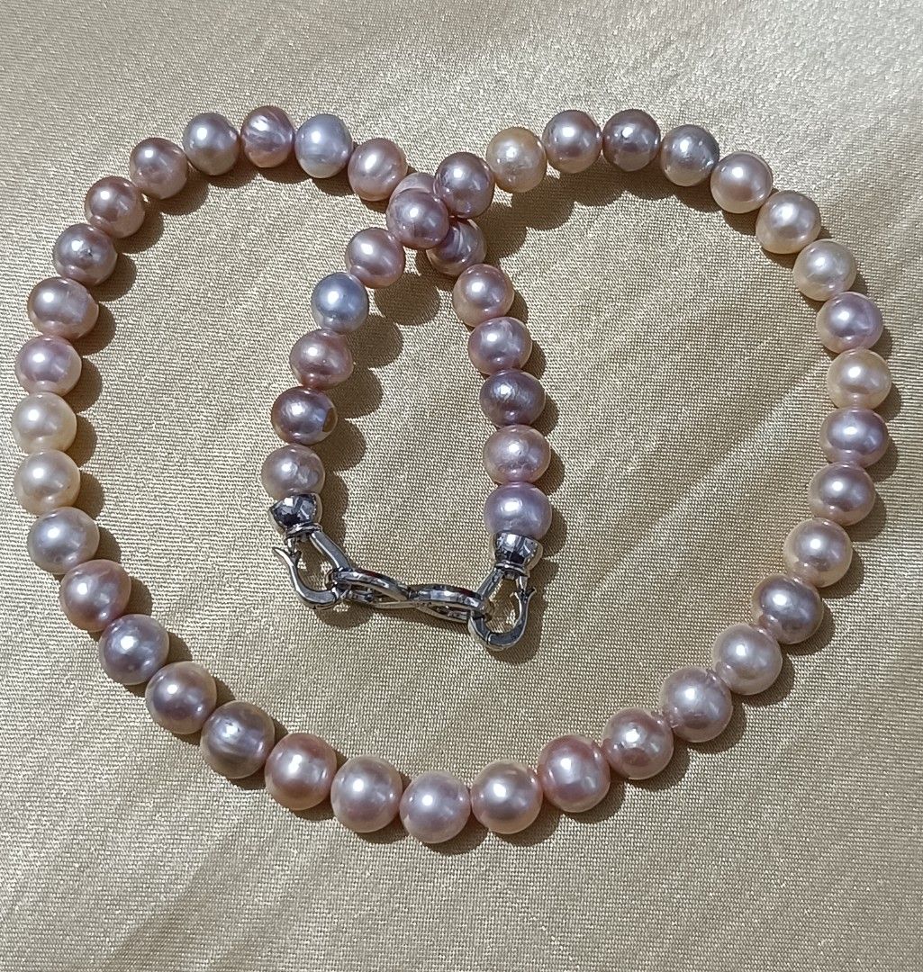 Authentic multishade freshwater pearl classic elegant necklace (Category: Necklaces) located in Imus. Submitted by luxegemjewels (Listing ID 1469635633, Image 3). Description: 🦪This elegant pearl necklace is the perfect addition to your jewelry collection. Composed of a series of carefully selected natural pearls, each pearl radiates a unique luster and hue, ranging from warm gold to soft pink, lavender, showcasing the artistry of nature. Elevat