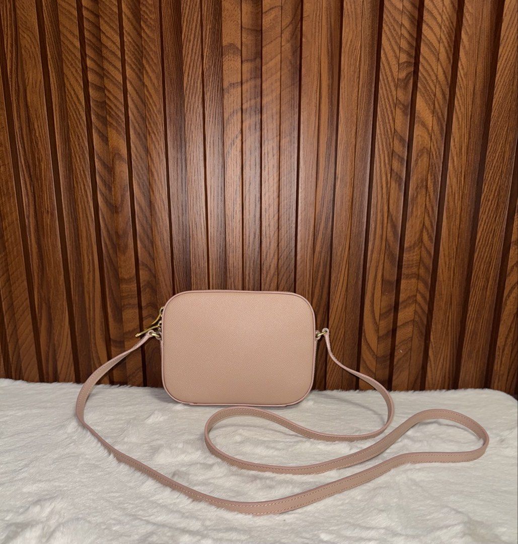 Authentic Saint Laurent YSL Camera Bag Leather (Category: Everything Else Others) located in Subic. Submitted by luxshoppe88 (Listing ID 1469707228, Image 3). Description: - Brand: Saint Laurent - Material: Premium textured leather - Hardware: Gold-tone YSL logo and matching strap rings - Closure: Secure zip top - Design: Structured rectangular shape with rounded corners - Condition: Pristine exterior with clean corners - Inclusion: Adjustable ma