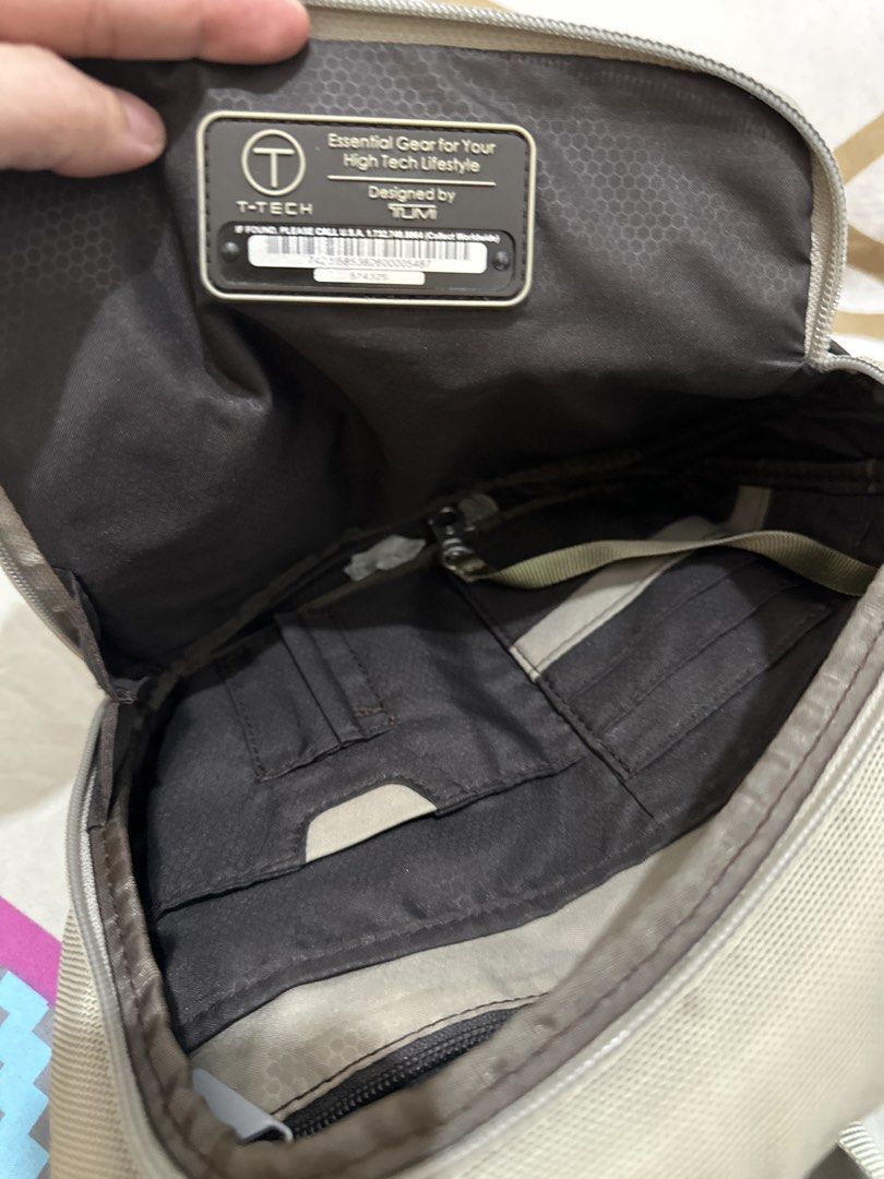 Authentic T-Tech by TUMI Crossbody / Sling Bag (Category: Sling Bags) located in Manila. Submitted by emily.santiago (Listing ID 1469634222, Image 3). Description: Brand: T-Tech by TUMI Model Code: 57432S Color: Khaki / Beige with Dark Brown Accents Material: Heavy-duty Ballistic Nylon / Polyester Features: Adjustable wide shoulder strap for maximum comfort Multiple zippered front & quick-access pockets Main compartment with dedicated organizer s