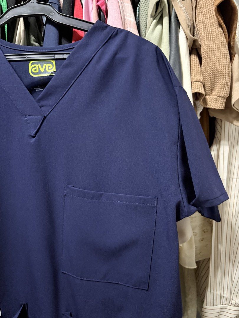AVE SCRUB TOP (Category: Shirts) located in San Marcelino. Submitted by abyanggg (Listing ID 1469676934, Image 3). Description: Unisex XL for women, L For men Dimes: B-44, S-18, L: 27 3 pocket scrub With pen holder No issues, cracked print due to washing Navy blue.
