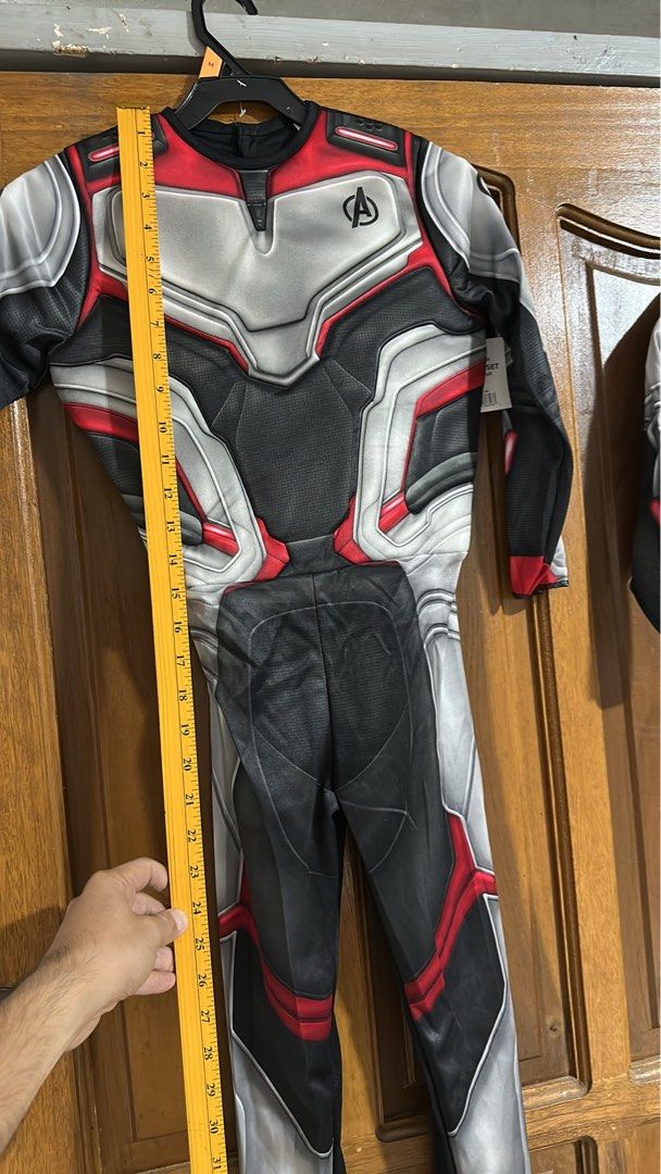 Avengers Endgame Quantum Suit Costume (Category: Babies & Kids Fashion) located in Quezon City. Submitted by breakstuf50 (Listing ID 1469732949, Image 2). Description: - Design: Iconic Avengers Endgame quantum suit in grey, black, and red with chest logo - Size: Medium (Tag attached) - Measurements: Chest width ~12", Sleeve length ~17", Total length ~31" - Style: Full-length jumpsuit - Condition: Great for parties, cosplay, and dress-up events.