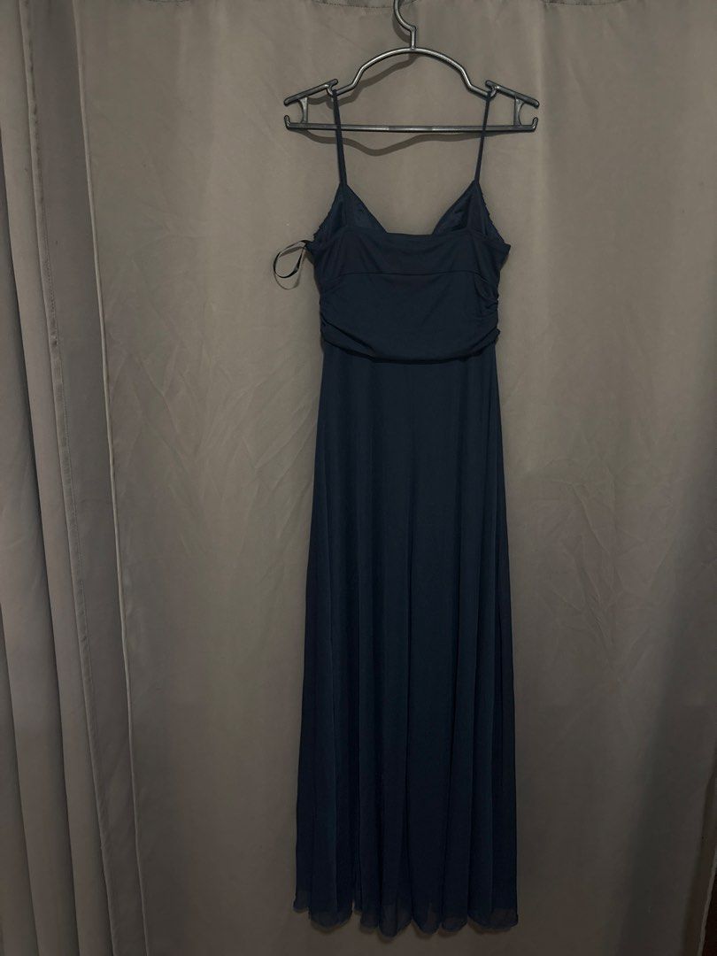 B. Smart Navy Blue Spaghetti Strap Maxi Dress (Category: Evening dresses & gowns) located in Cabuyao City. Submitted by airpz (Listing ID 1469669147, Image 3). Description: - Color: Smart navy blue - Style: Long dress with spaghetti straps, pleated bodice, and gathered waist - Details: Flowy skirt with a stylish draped front accent - Material: 100% polyester shell and lining (Made in Philippines).