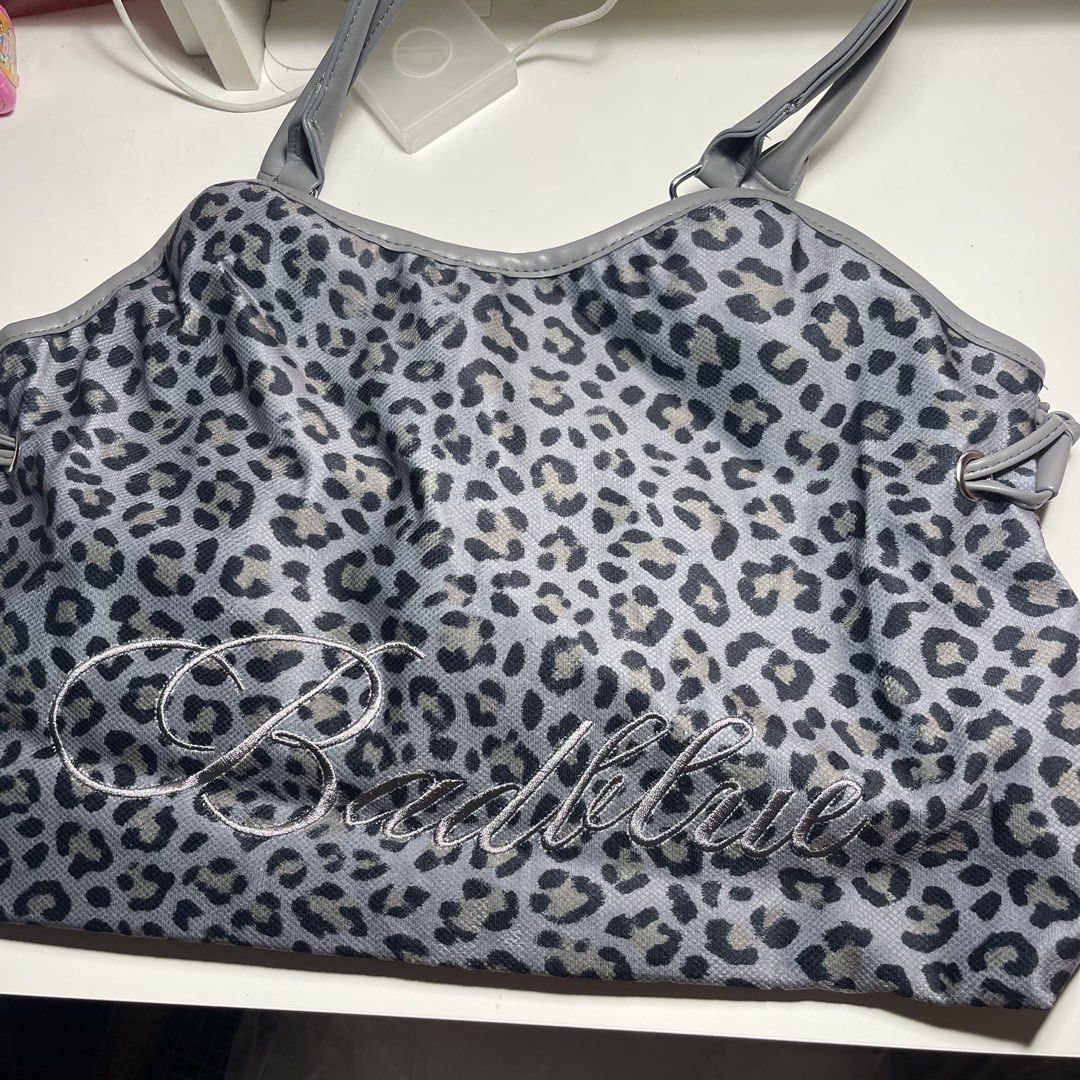 Bad Blue Insp Bag (Category: Tote Bags) located in Manila. Submitted by gomdobear (Listing ID 1469624201, Image 1). Description: - brand new - bought from taobao - never used! just opened to check! [SIZE & FIT] The Dimsum Bag, crafted in printed leopard fabric. • Fits up to a 16” MacBook Pro • Bag charm included • Model’s height 172cm • Height 30cm • Width 42cm • Depth 13.5cm • Strap 22cm [FABRIC] Shell: 100% Cotton Lining: 100% Polyester .