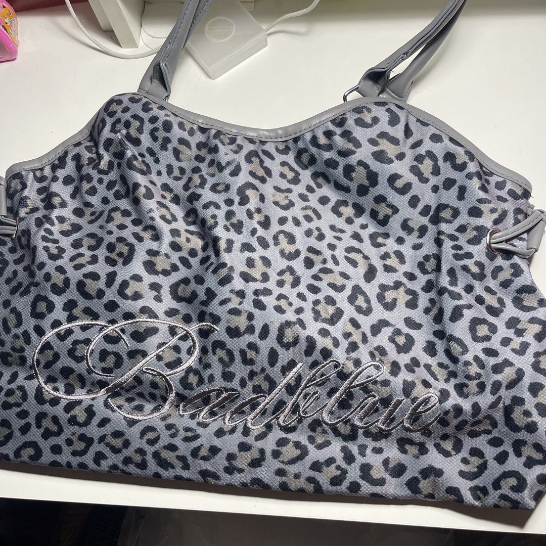 Bad Blue Insp Bag (Category: Tote Bags) located in Manila. Submitted by gomdobear (Listing ID 1469624201, Image 2). Description: - brand new - bought from taobao - never used! just opened to check! [SIZE & FIT] The Dimsum Bag, crafted in printed leopard fabric. • Fits up to a 16” MacBook Pro • Bag charm included • Model’s height 172cm • Height 30cm • Width 42cm • Depth 13.5cm • Strap 22cm [FABRIC] Shell: 100% Cotton Lining: 100% Polyester .