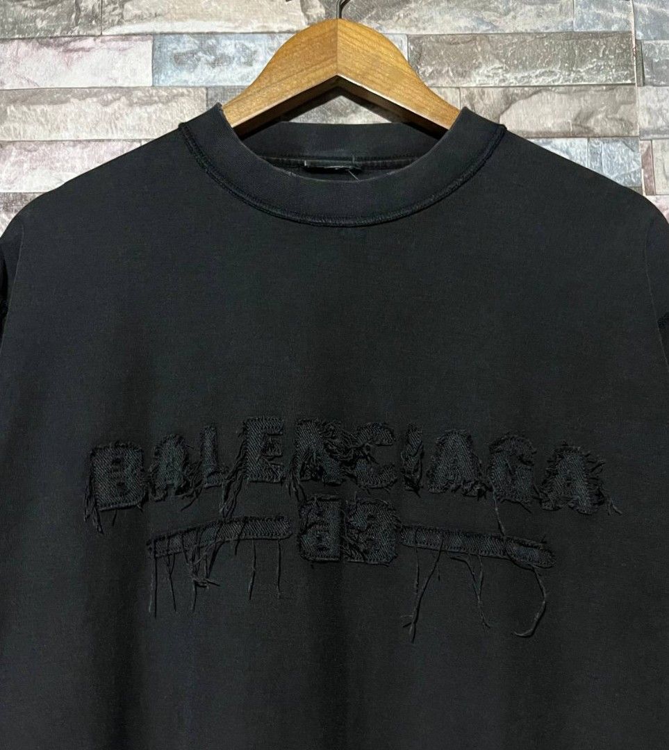 BALENCIAGA DESTROYED LOGO TEE (Category: Luxury Apparel) located in Caloocan City. Submitted by wewearworn (Listing ID 1469577261, Image 2). Description: XL Best Fit 23 x 30 Excellent No issues (cut necktag lang) 9.5/10 Color Rate.
