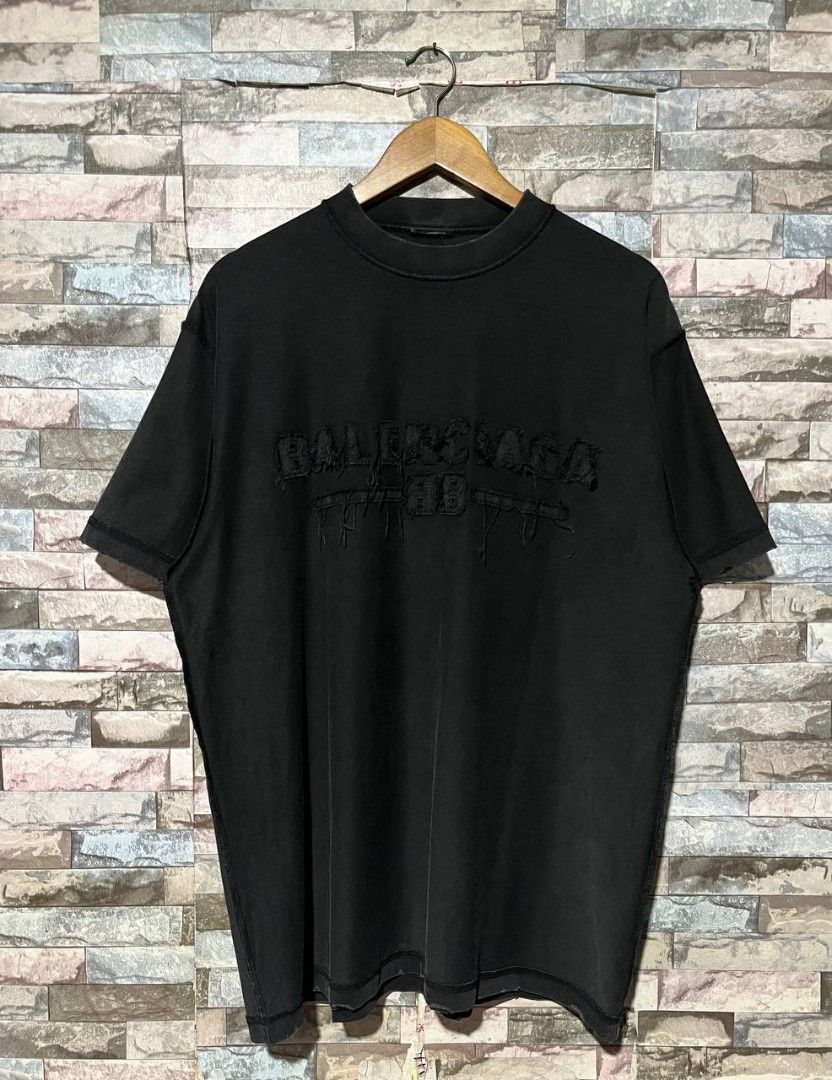BALENCIAGA DESTROYED LOGO TEE (Category: Luxury Apparel) located in Caloocan City. Submitted by wewearworn (Listing ID 1469577261, Image 1). Description: XL Best Fit 23 x 30 Excellent No issues (cut necktag lang) 9.5/10 Color Rate.