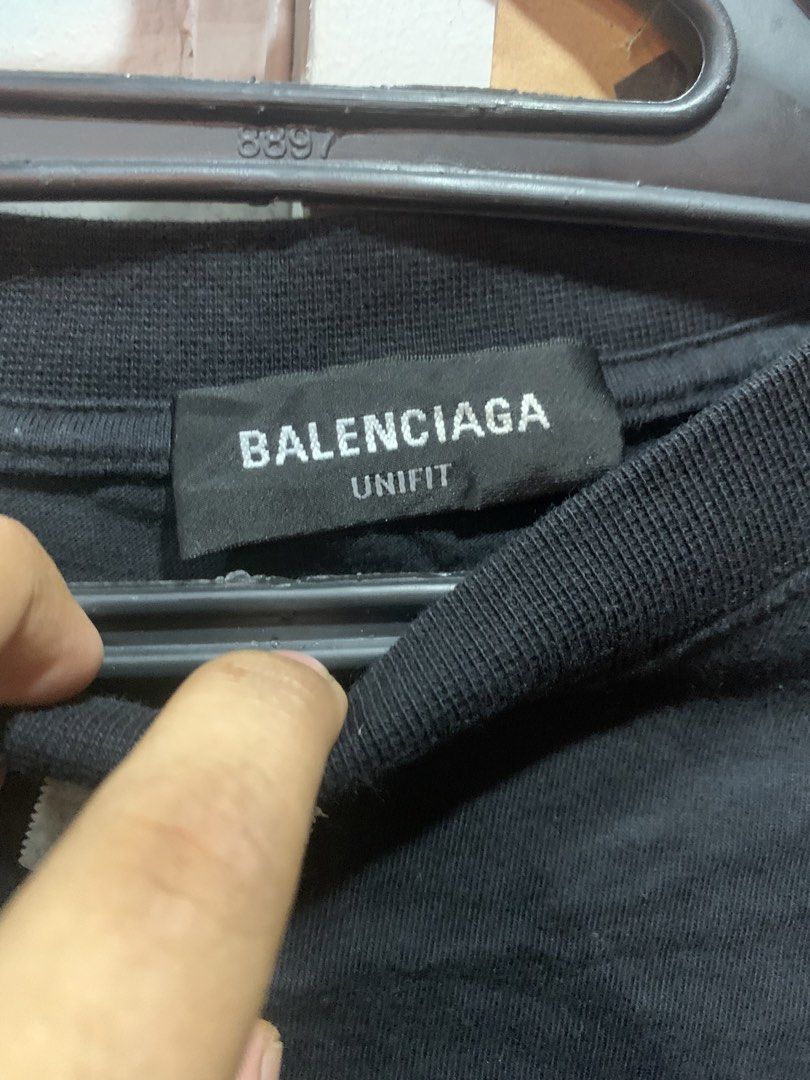 Balenciaga Unifit Rhinestone Logo Tee Black (Category: Luxury Apparel) located in Cagayan de Oro. Submitted by agboysalis60090 (Listing ID 1469710375, Image 3). Description: - Authentic Balenciaga Unifit T-Shirt in classic black - Size: M (Oversized fit) - Made in Portugal - Design: Rhinestone logo graphic across the back with Balenciaga Paris branding - Details: Crew neck, short sleeves - Condition: Brand new with neck and care tags attached.