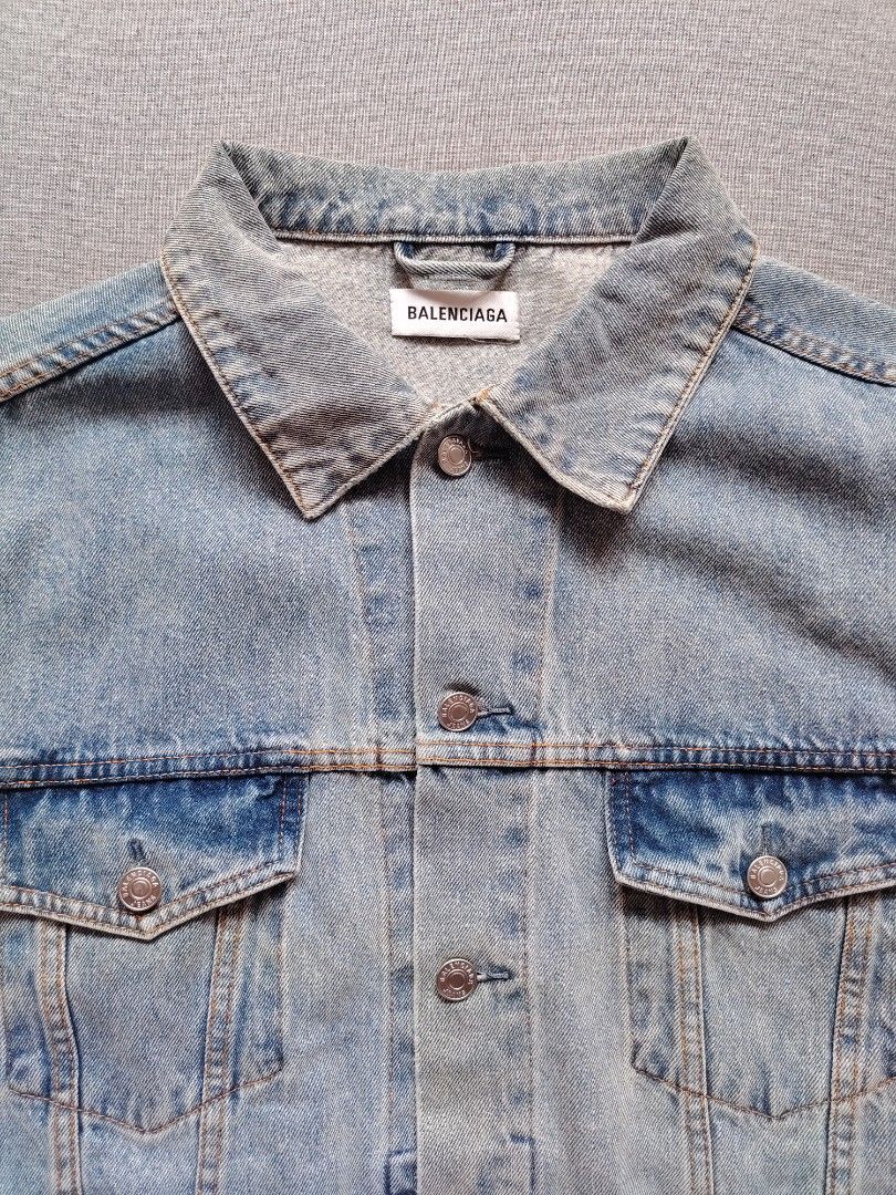 BALENCIAGA Washed Denim Jacket (Rhinestone Back Logo) (Category: Luxury Apparel) located in Taguig. Submitted by _theroom.ph (Listing ID 1469637088, Image 2). Description: - Brand: Balenciaga - Style: Oversized denim jacket with button closure and chest pockets - Wash: Light blue - Size: 36 (Made in Italy) - Details: Eye-catching sparkly rhinestone 'Balenciaga' logo on the back - Hardware: Heavy branded metal buttons - Condition: Excellent / Well