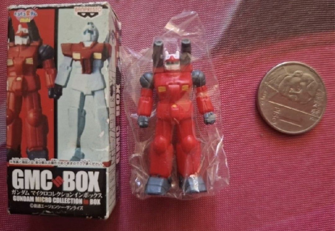 Banpresto GMC Box Gundam Micro Collection Figure (Category: Gundam & Model Kits) located in Arayat. Submitted by collectorboy143 (Listing ID 1469582449, Image 1). Description: - Authentic Banpresto GMC Box Gundam Micro Collection miniature figure - Red mobile suit model design - Brand new and sealed inside original clear plastic packaging - Comes with original Japanese text cardboard box and product art - Tiny collectible item (refer to coin for 