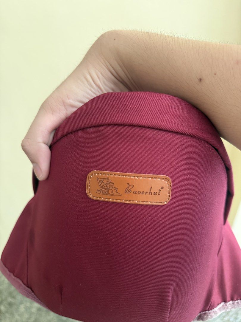 Baoerhui Maroon Baby Carrier (Category: Carriers & Slings) located in Calamba. Submitted by leeadriannn796 (Listing ID 1469640428, Image 3). Description: - Brand: Baoerhui - Color: Maroon with soft blue interior lining - Comfort: Padded shoulder straps for extra support - Fit: Fully adjustable buckles - Condition: Clean fabric, sturdy construction, and ready for your little one.
