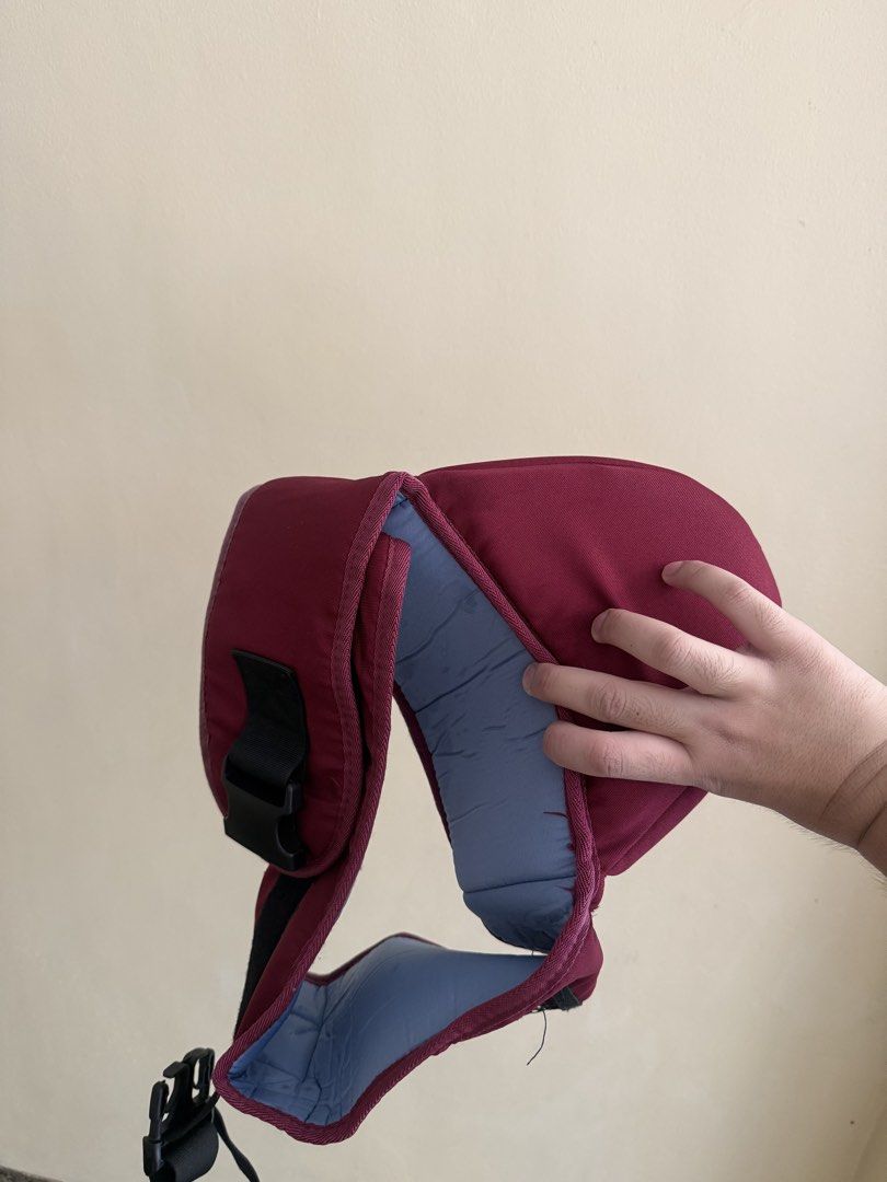 Baoerhui Maroon Baby Carrier (Category: Carriers & Slings) located in Calamba. Submitted by leeadriannn796 (Listing ID 1469640428, Image 2). Description: - Brand: Baoerhui - Color: Maroon with soft blue interior lining - Comfort: Padded shoulder straps for extra support - Fit: Fully adjustable buckles - Condition: Clean fabric, sturdy construction, and ready for your little one.