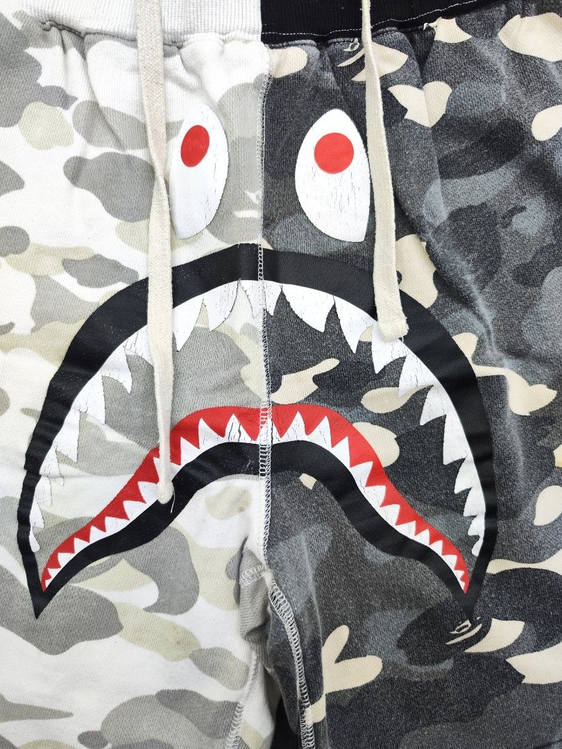 Bape Shark Camou Shorts (Category: Shorts) located in Bulacan. Submitted by emilj23 (Listing ID 1469595576, Image 2). Description: Bape Shark Camou Shorts Size L on tag L 18.5 W 28-32 Leg Hole 12 Condition 8.5/10 Color rate 8.5/10 Issue Crackprints,Minimal Stain.