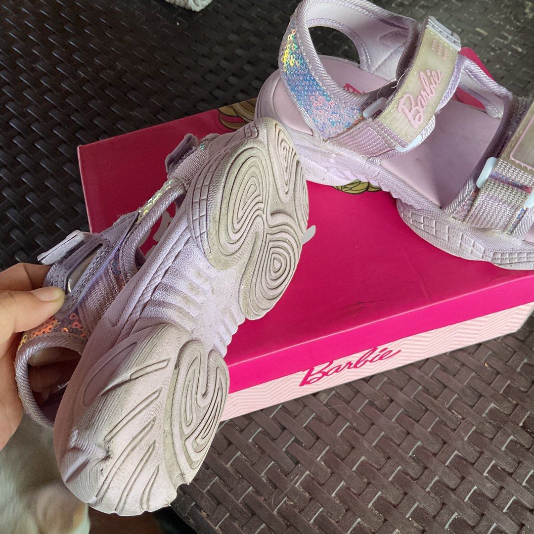 Barbie Deja Lavender Sandals Size 11 (Category: Flats & Sandals) located in Cavite. Submitted by rachel052917 (Listing ID 1469607323, Image 2). Description: - Brand/Style: Barbie 'Deja' from SM Store - Color: Lavender - Size: Kids US 11 - Features: Shiny sequin heel detailsi, secure velcro strap closures on top and back, signature Barbie logo branding - Inclusions: Original pink branded shoe box Kulang lng sa linis.